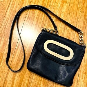Black and gold Michael Kors purse